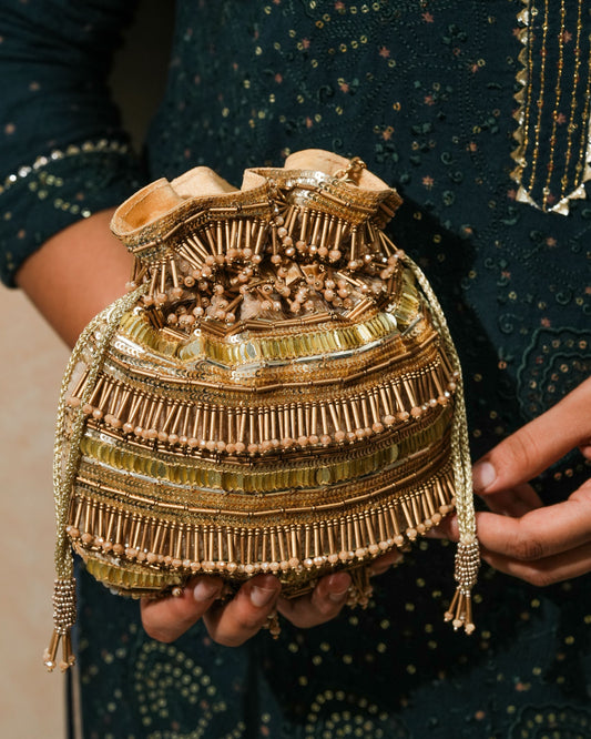 Golden polma tassel potli