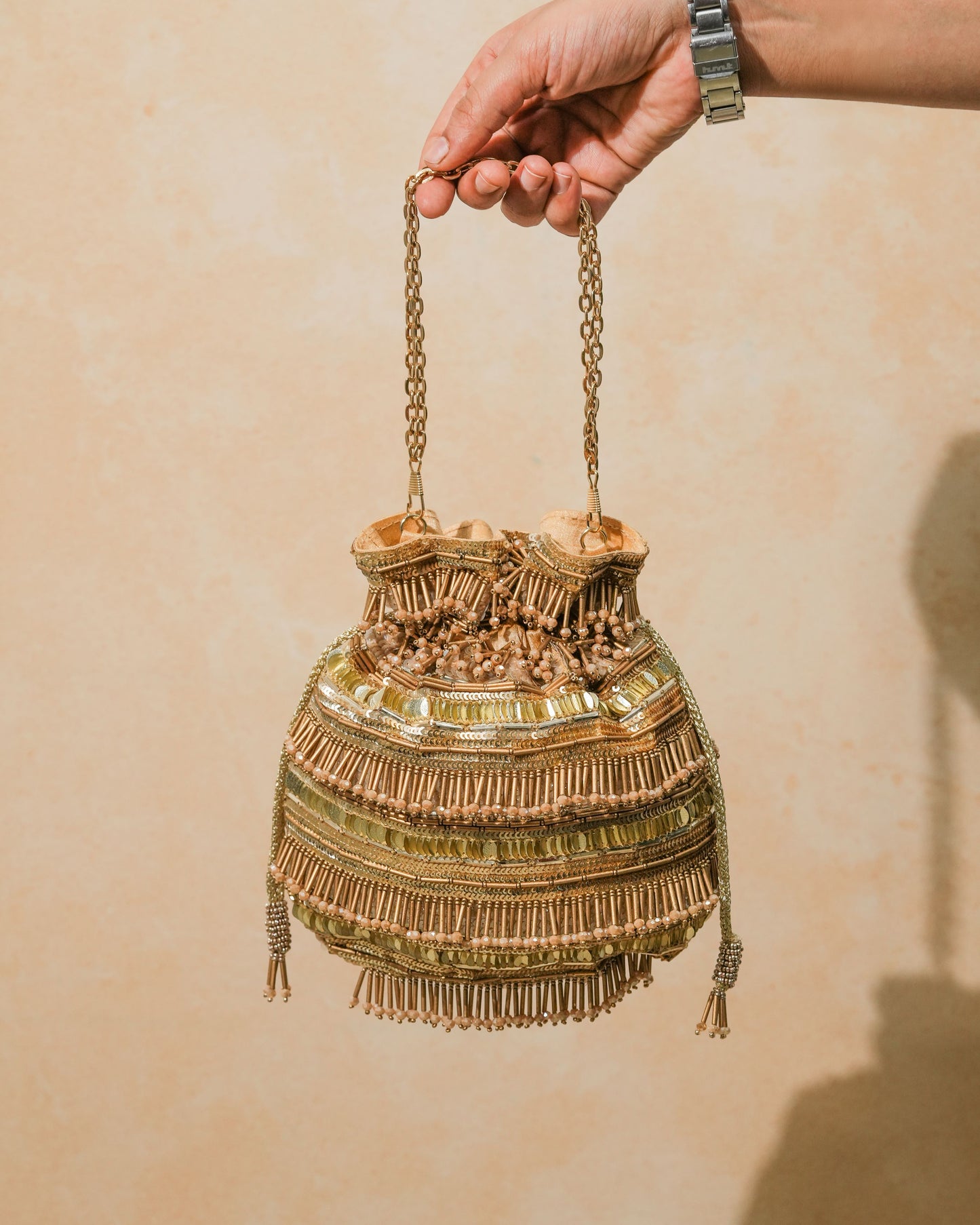 Golden polma tassel potli