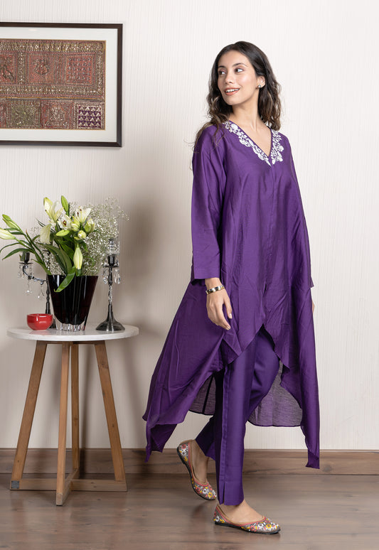 Purple chanderi assymetrical kurta with floral embroidery paired with Chanderi pants
