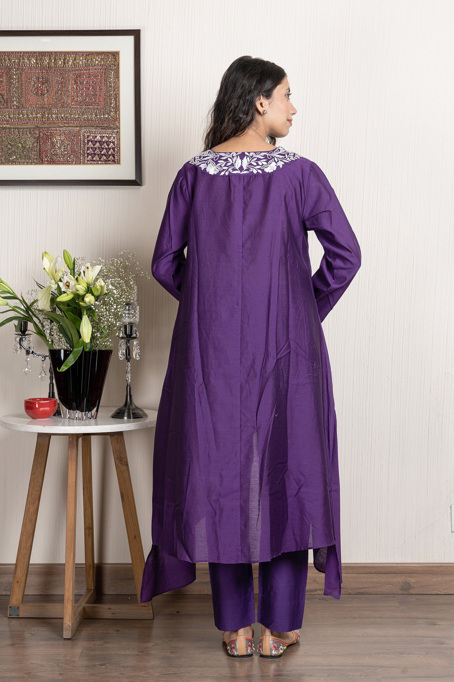 Purple chanderi assymetrical kurta with floral embroidery paired with Chanderi pants