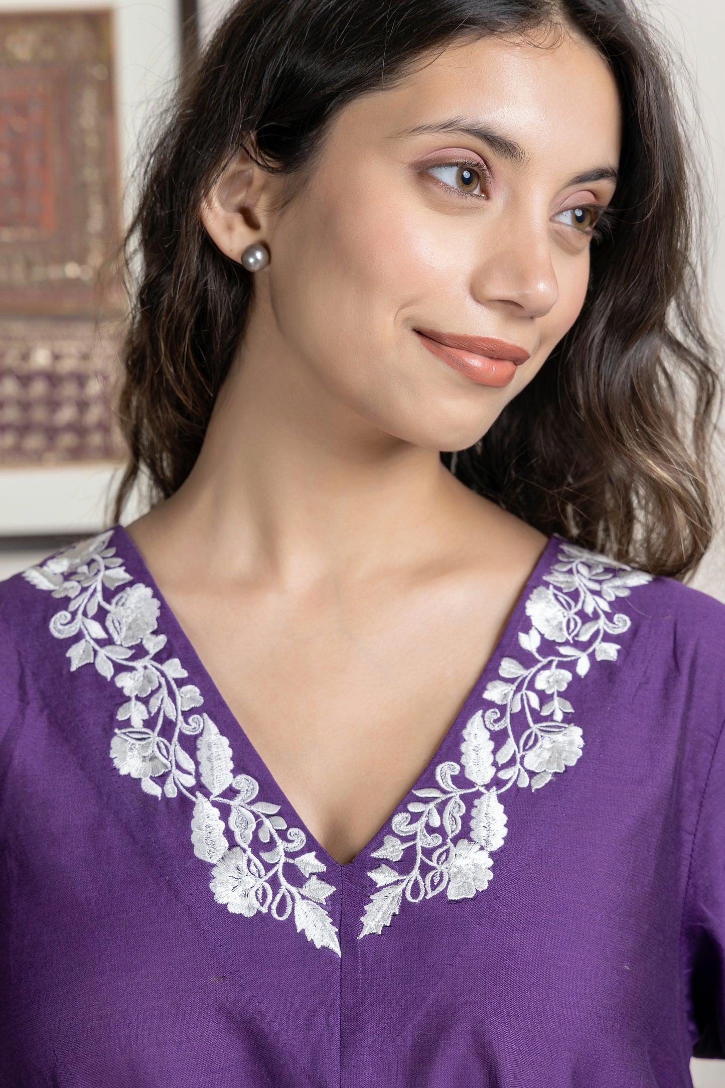 Purple chanderi assymetrical kurta with floral embroidery paired with Chanderi pants