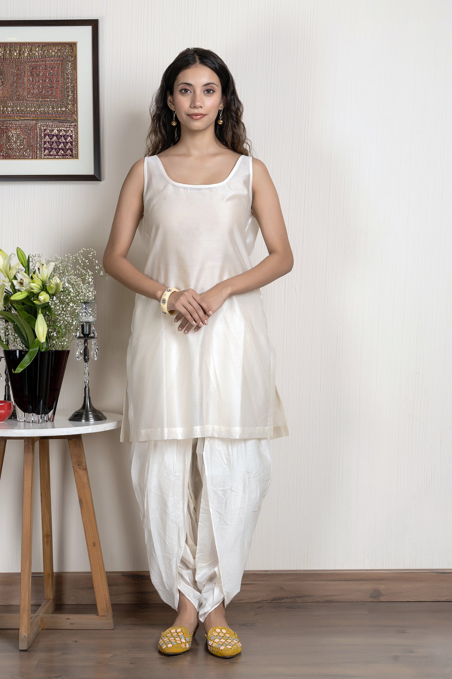 Chanderi sleeveless short kurta paired with embroidered jacket and dhoti pants