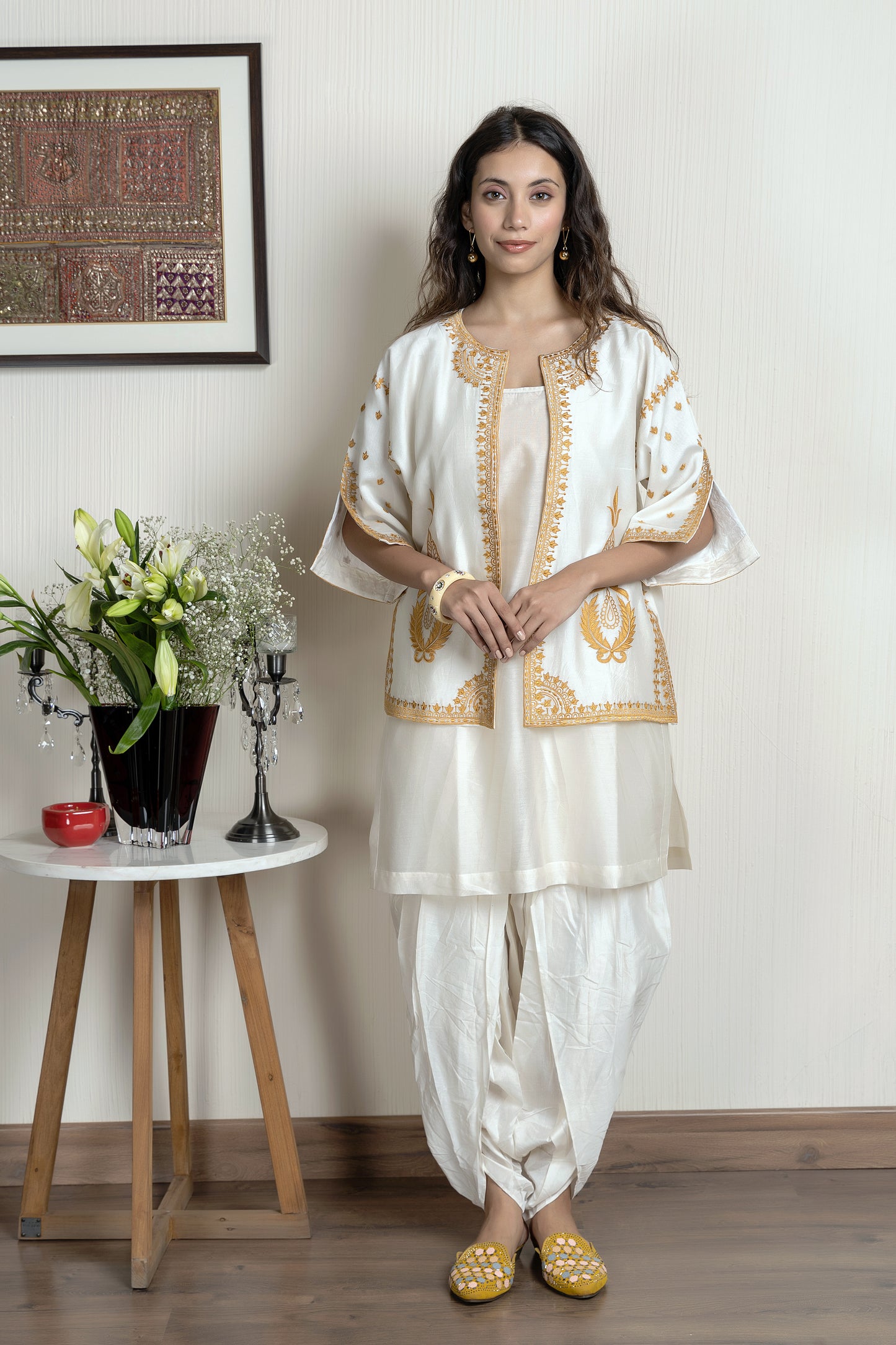 Chanderi sleeveless short kurta paired with embroidered jacket and dhoti pants