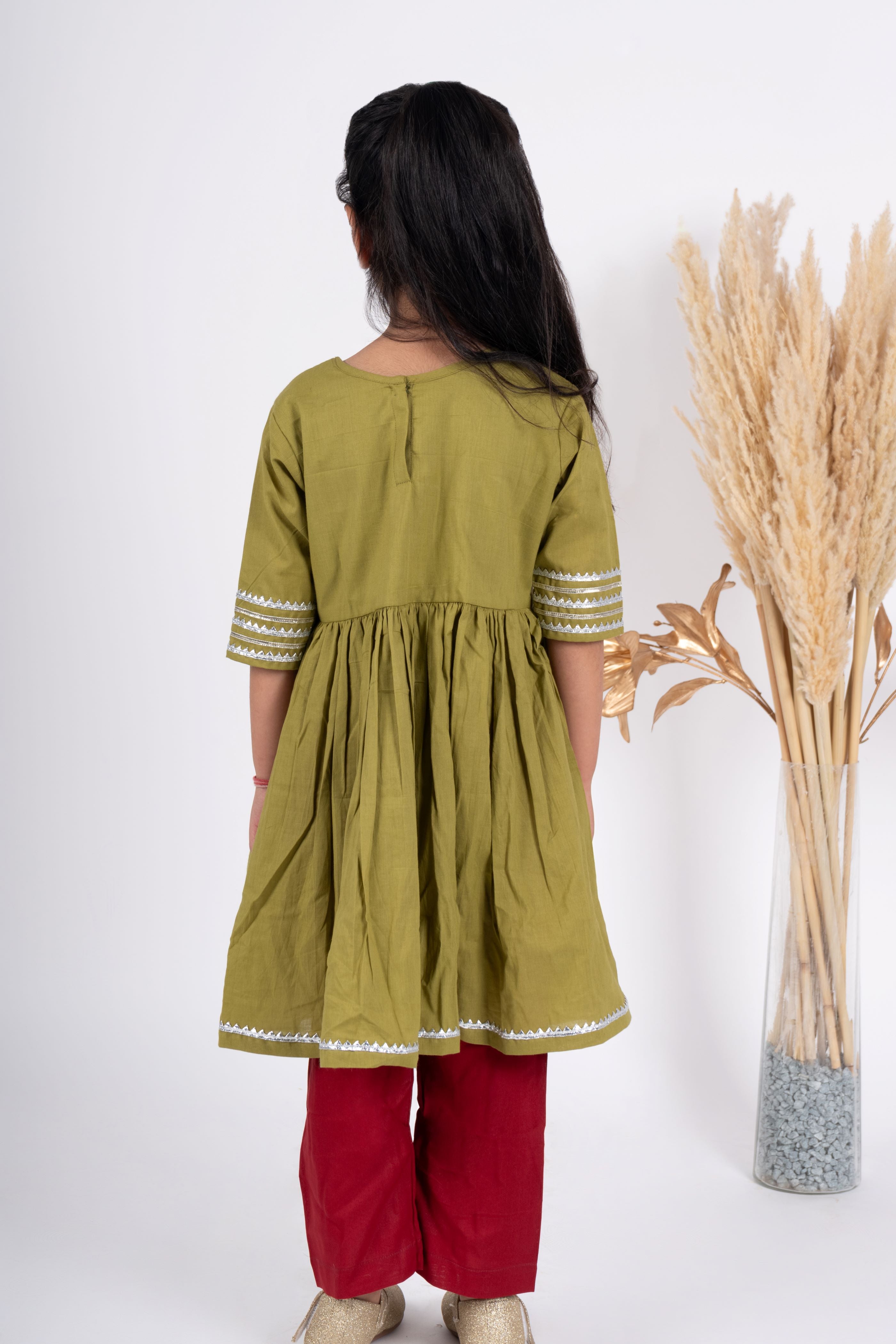 Girls green and maroon kurta payjama set