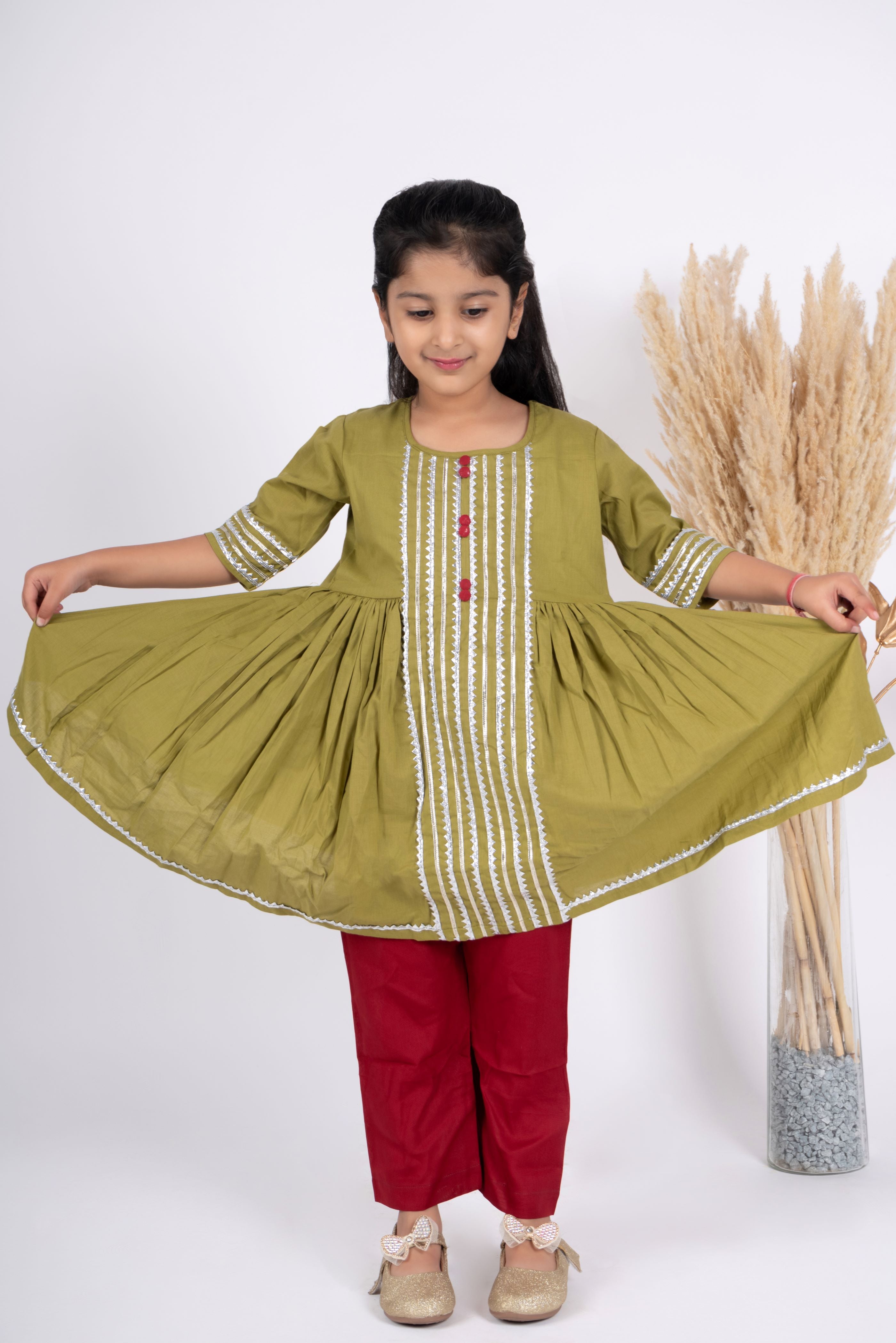 Girls green and maroon kurta payjama set