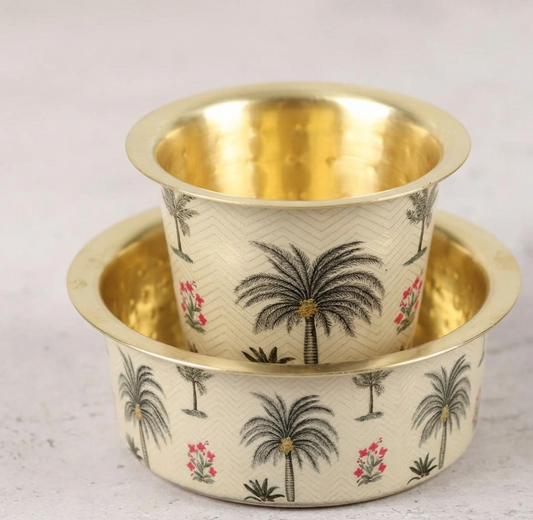 Two brass pots with palm tree design on a light background.
Filter Coffee Dabara and tumbler set, for your coffee evenings. made for coffee lovers who enjoy indian filter coffee