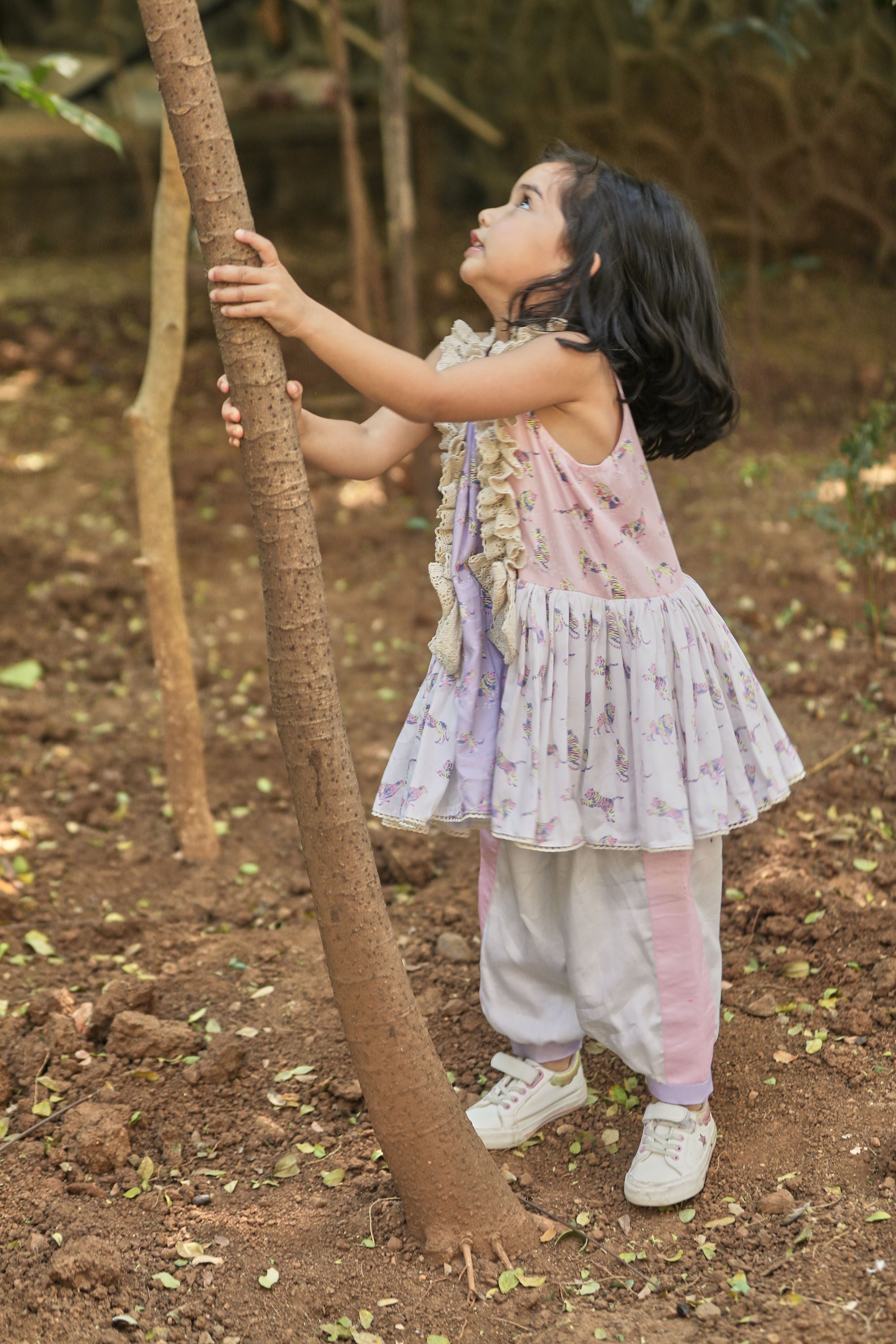 Off-white, pink, lavender animal print A-line kurta with frills & salwar set