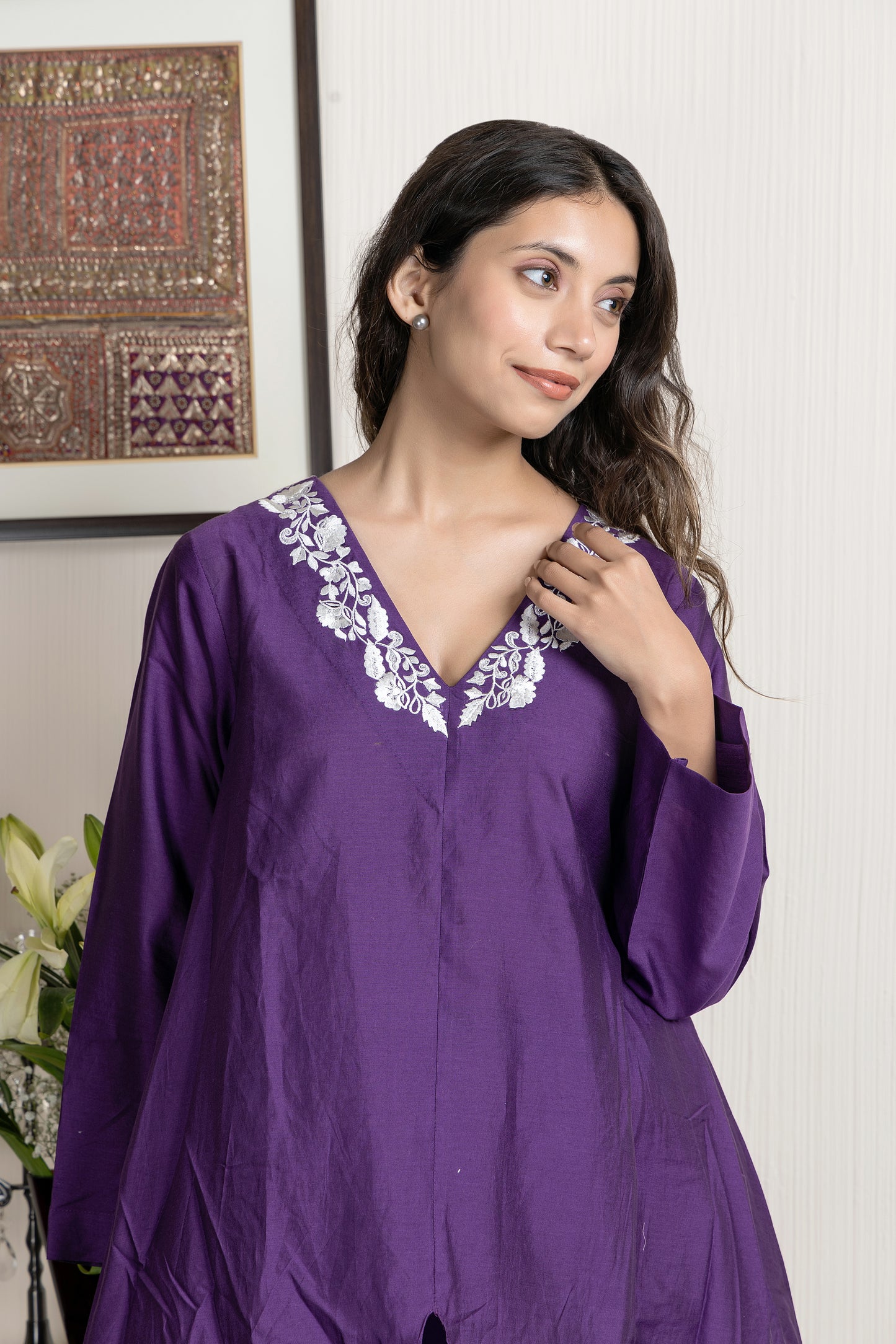 Purple chanderi assymetrical kurta with floral embroidery paired with Chanderi pants