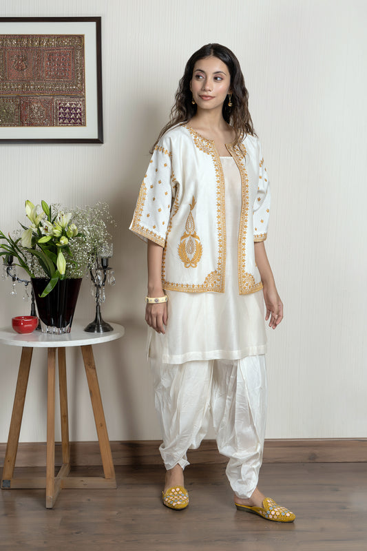 Chanderi sleeveless short kurta paired with embroidered jacket and dhoti pants